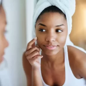 a woman touching her face