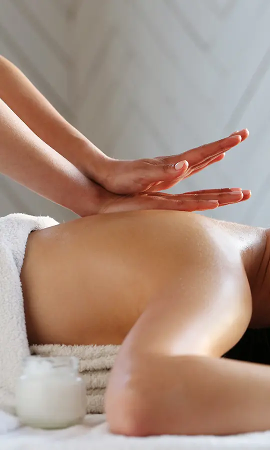 a person receiving a back massage